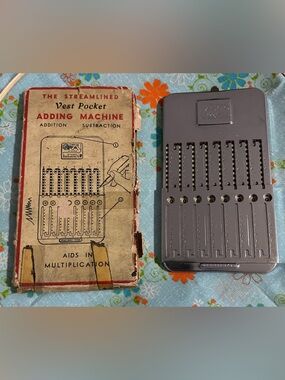 Tasco Streamlined Vest Pocket Adding Machine - original box with instructions.